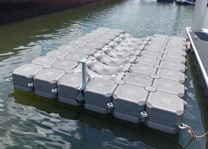 Floating Docks Modular Dock sitting in water.