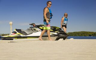 A happy couple enjoys the ease of use of Floating Docks Modular dock for parking their Jet Ski.