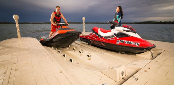 A couple use Floating Docks SLX6 Personal Watercraft port with their Jet Ski.