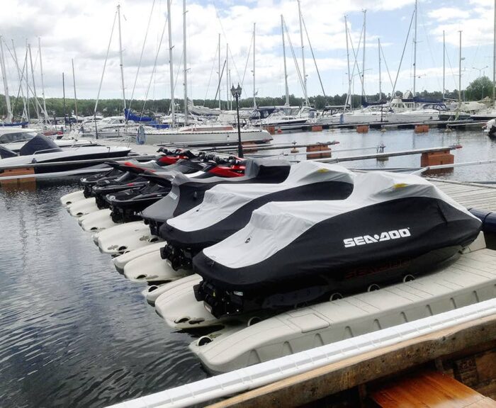 Four jet ski's are secured to Floating Docks SLX6 Personal Watercraft ports.